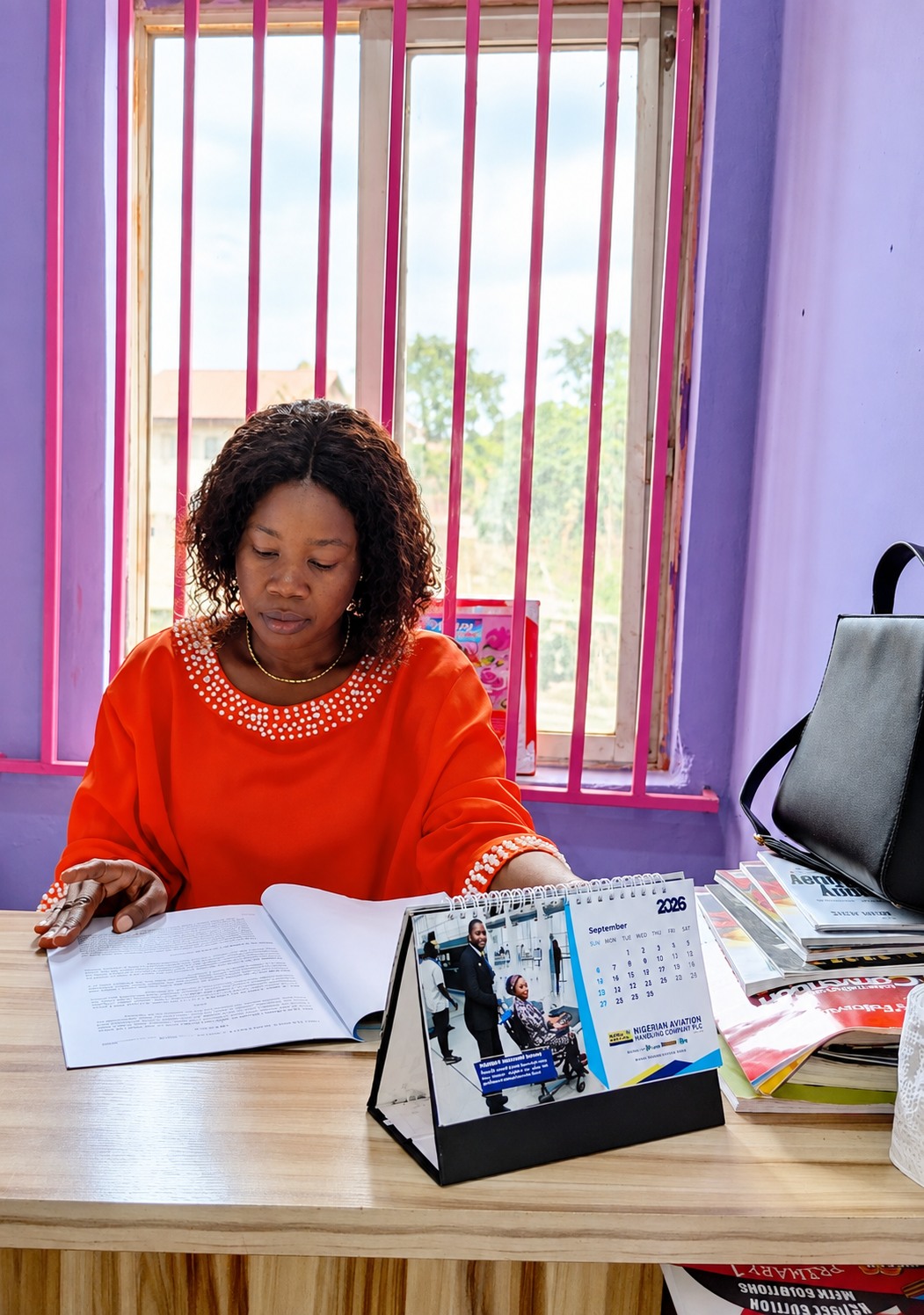 The proprietress of King Best at her desk